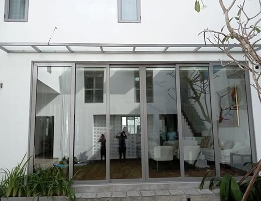House side view with sliding windows